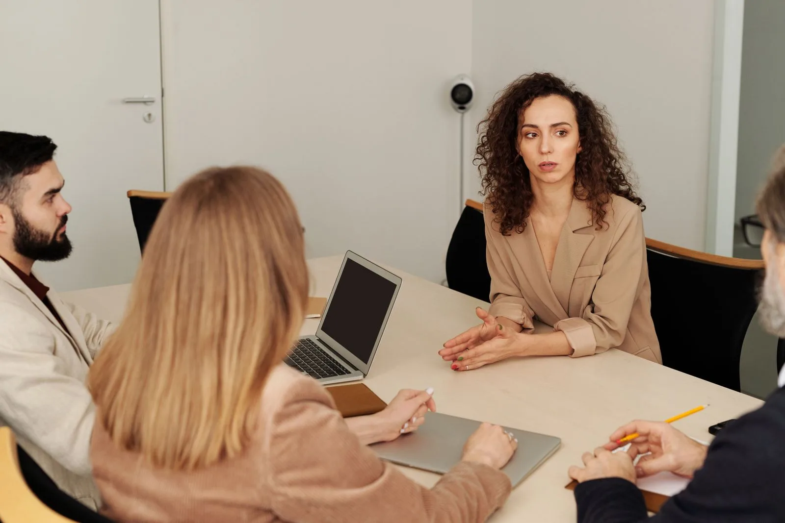 A cross-functional team meeting in a modern office