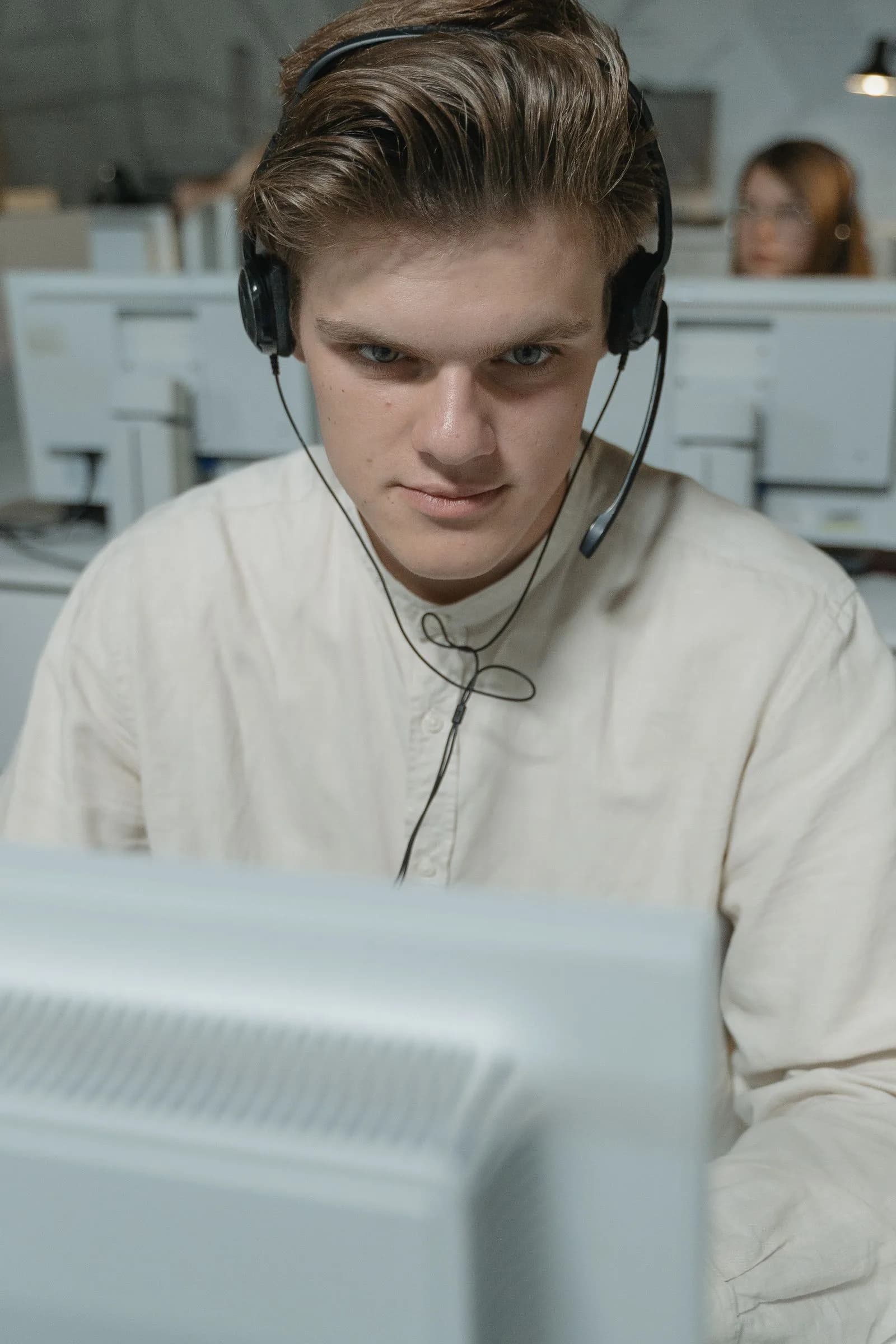 A technical support professional working at a computer