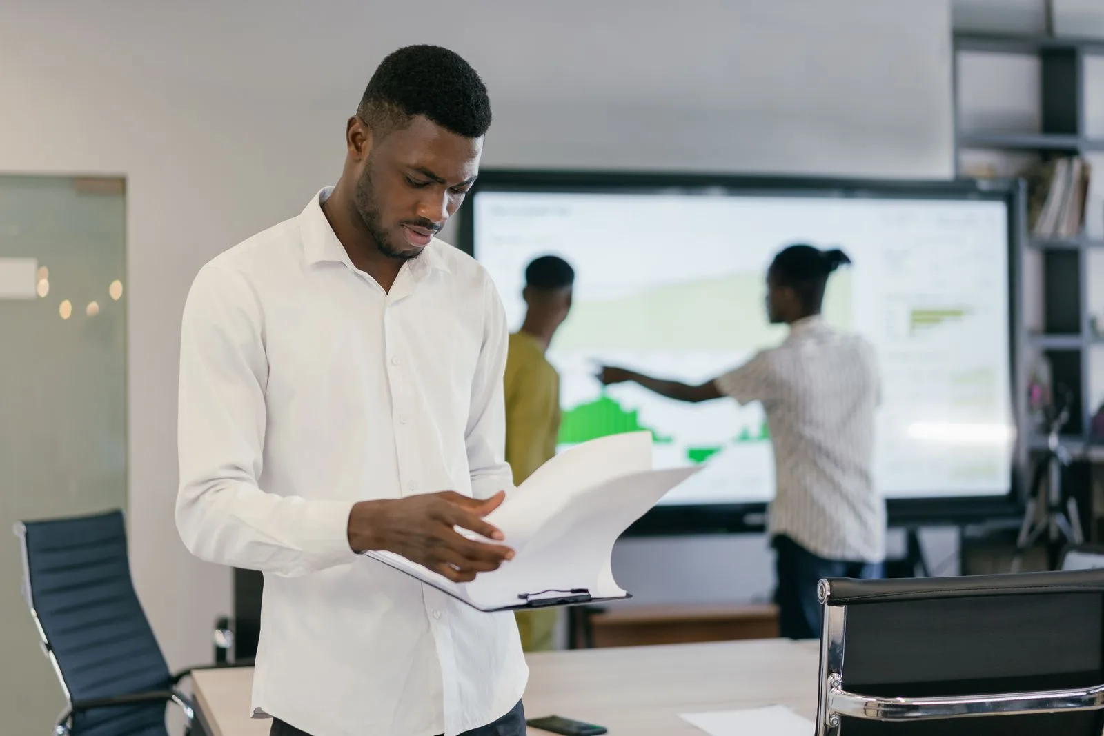 A team reviewing a report together in an office