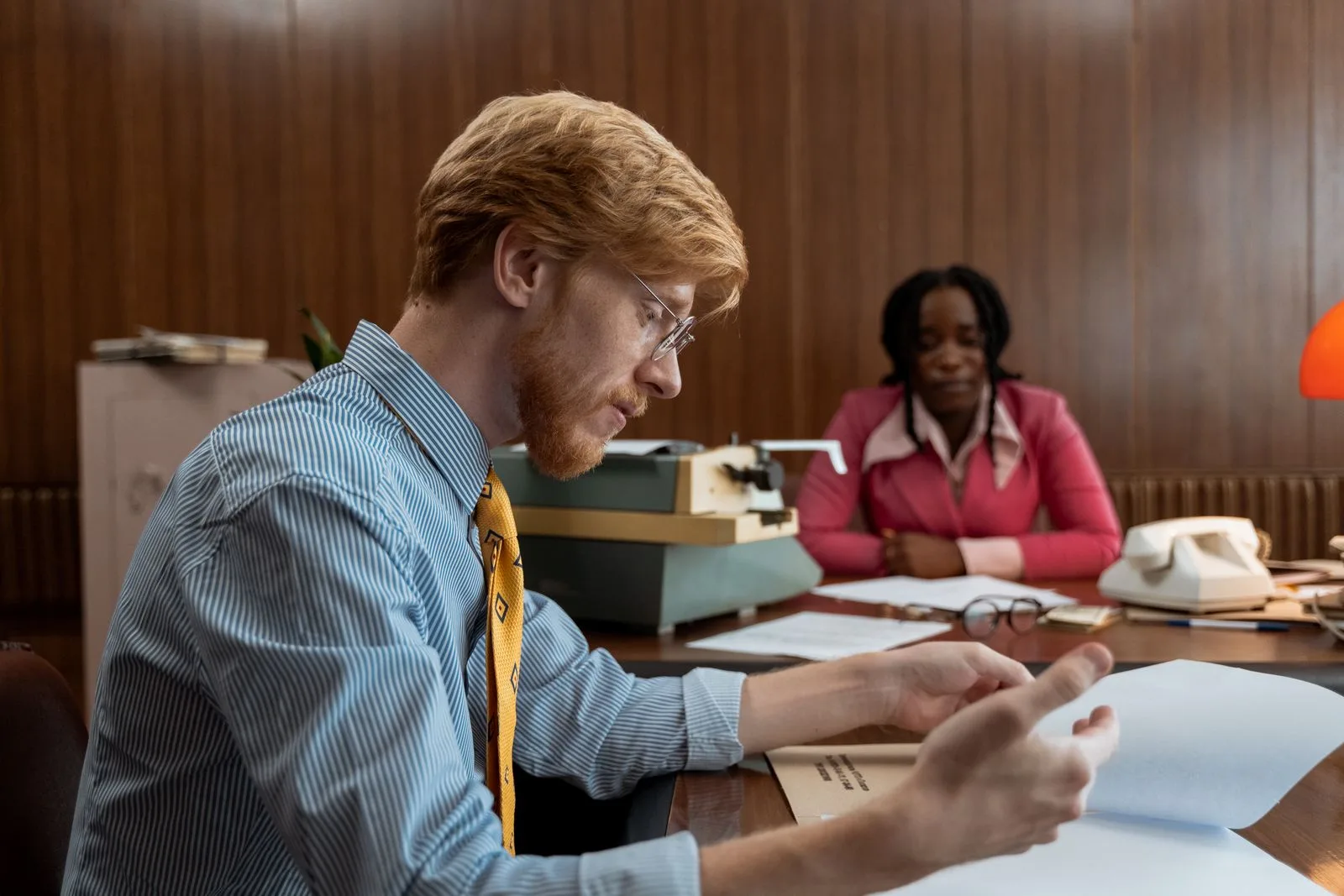 Professionals reviewing technical documents together