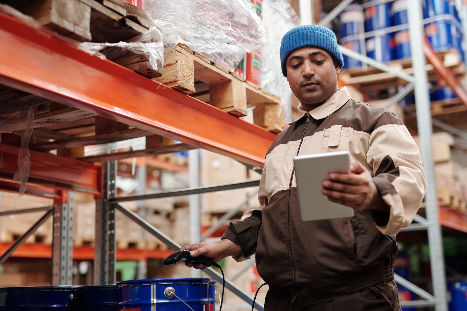 An operations specialist checking inventory with a tablet