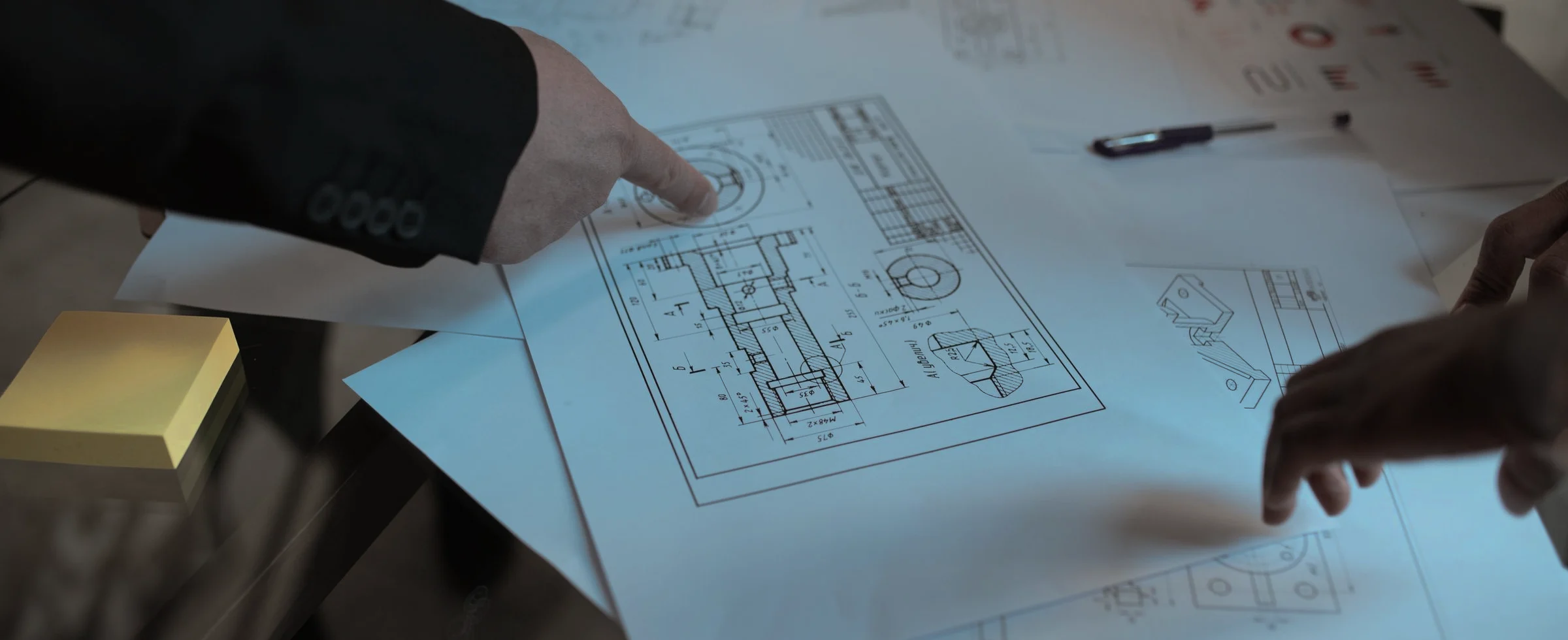 Engineers reviewing a technical plan and its decision points