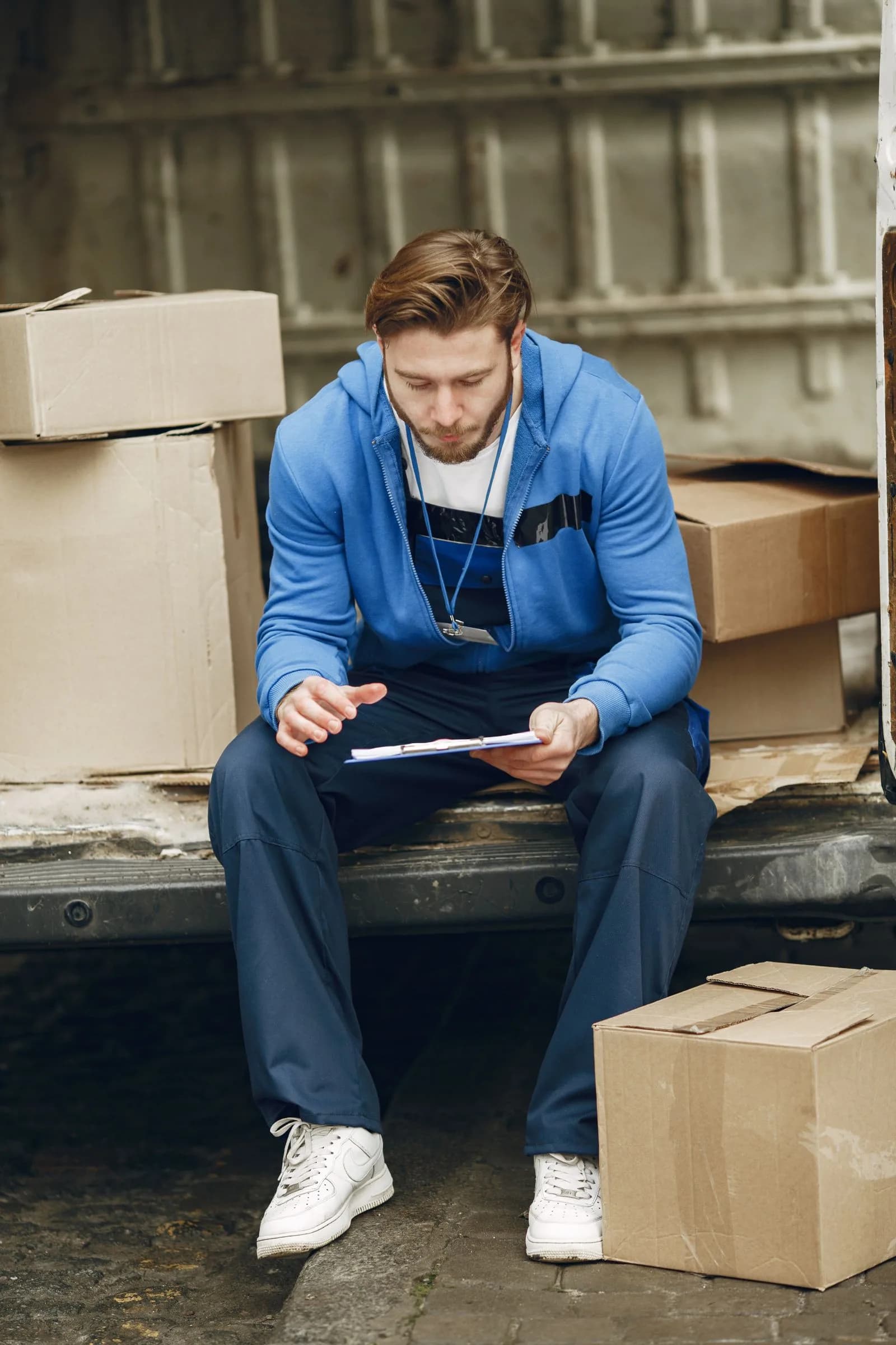 An operations professional reviewing inventory paperwork