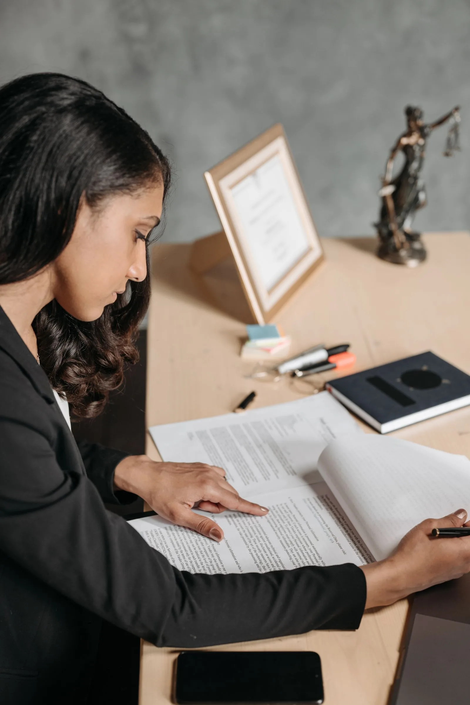A professional carefully reviewing policy documents